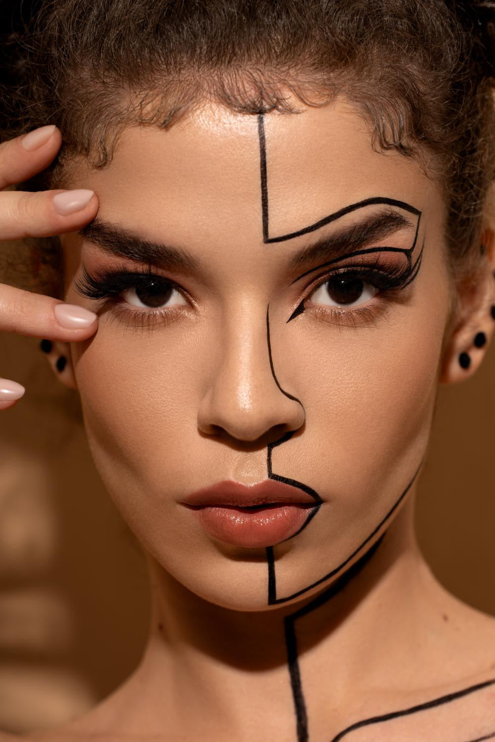 Artistic portrait with geometric black lines drawn across face